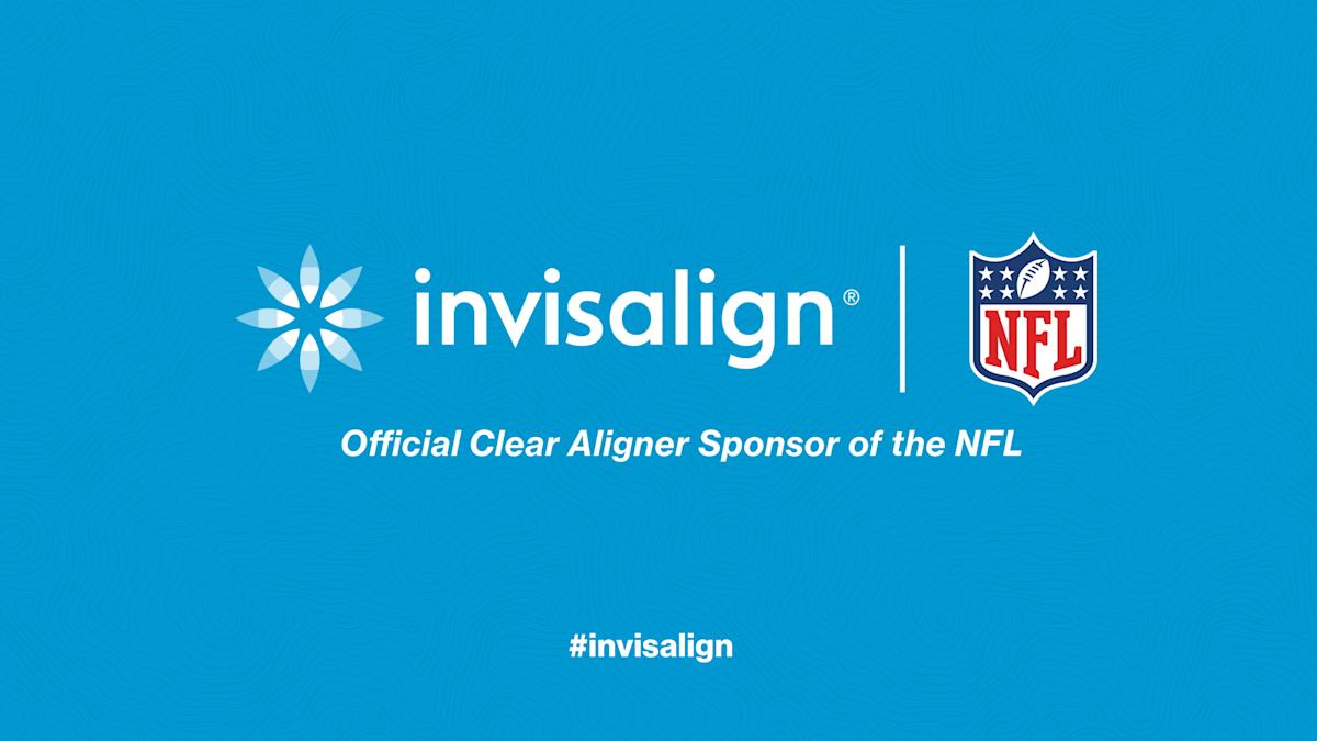 A close-up of Invisalign clear aligners with an NFL logo in the background, highlighting their sponsorship and orthodontic innovation.